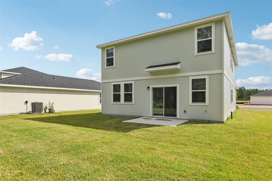 Exterior details and patio area of a home in Flagler Village - Classic Series, Palm Coast (Image 3). Exterior details and patio area of a home in Flagler Village - Classic Series, Palm Coast (Image 3).