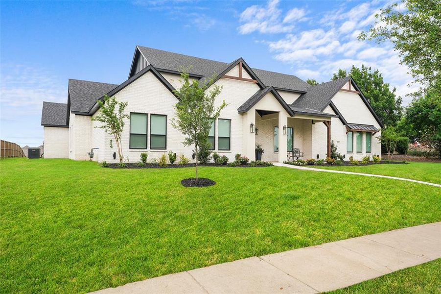 Front exterior of a new home in , Forney, TX, highlighting curb appeal (Image 25).