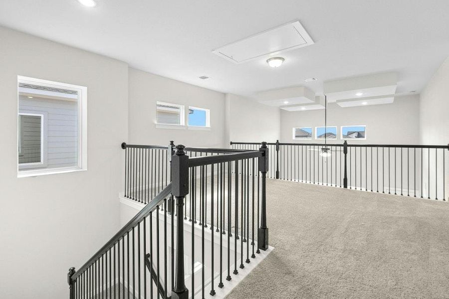 Corridor with carpet and recessed lighting