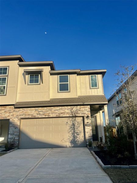 Front exterior of a new home in Bridgeland, Cypress, TX, highlighting curb appeal (Image 2). Front exterior of a new home in Bridgeland, Cypress, TX, highlighting curb appeal (Image 2).