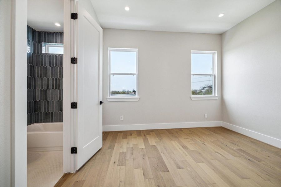 Guest bedroom located down the hallway from primary. Large enough for a kind bed set and more!