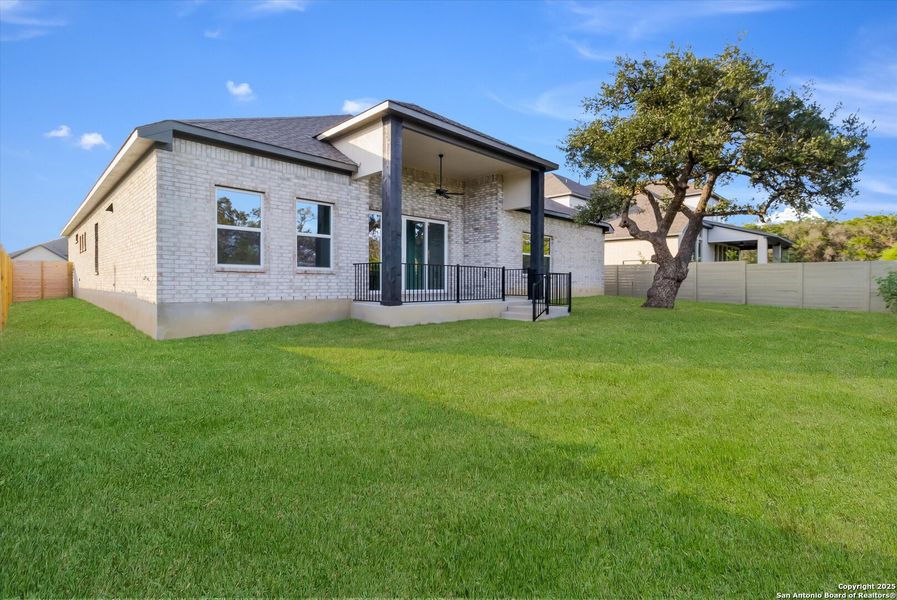 Front exterior of a new home in The Grove at Vintage Oaks, New Braunfels, TX, highlighting curb appeal (Image 15).