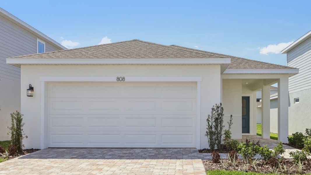 Representative exterior photo of a completed home built from the Flagler by DRB Homes in Willowbrook North, Winter Haven, FL (Image 7).