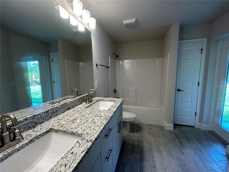 2 Bathroom has 3 cm Granite Countertops with Dual Sinks and Cabana Bath Door to Lanai 2 Bathroom has 3 cm Granite Countertops with Dual Sinks and Cabana Bath Door to Lanai