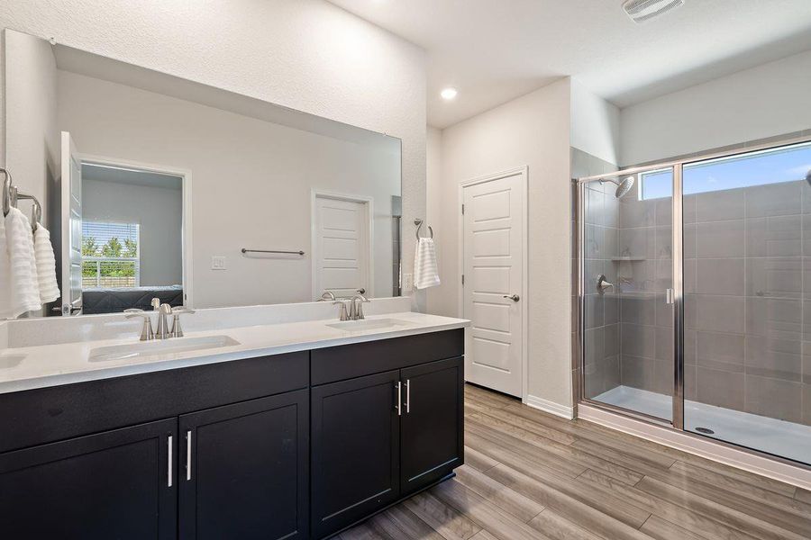 Versatile bedroom currently used as a playroom, featuring a stylish green accent wall and abundant natural light. Versatile bedroom currently used as a playroom, featuring a stylish green accent wall and abundant natural light.