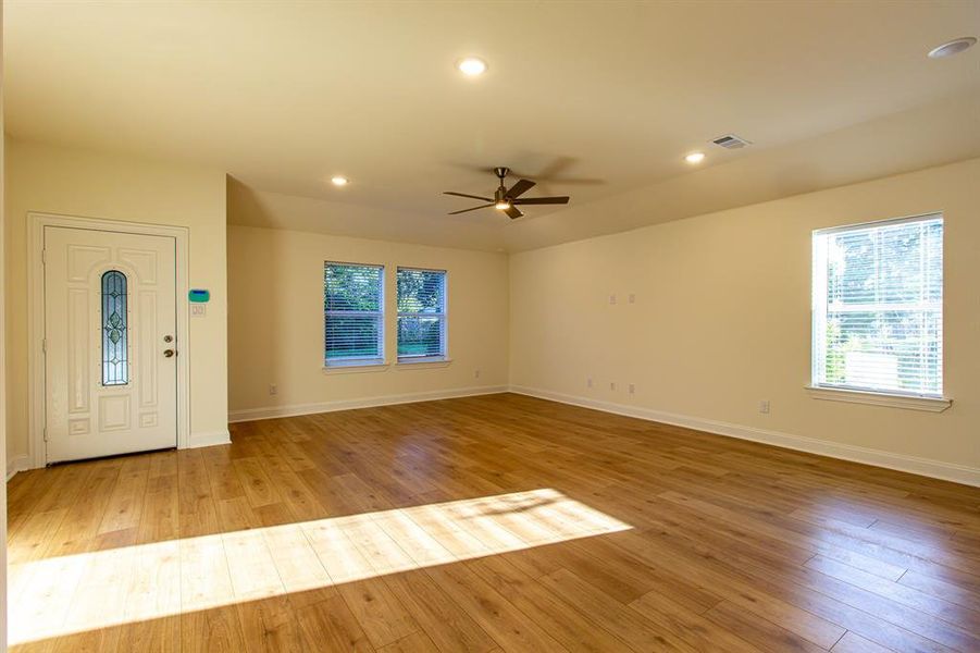 Entrance foyer with light wood-type flooring, ceiling fan, and recessed lighting Entrance foyer with light wood-type flooring, ceiling fan, and recessed lighting