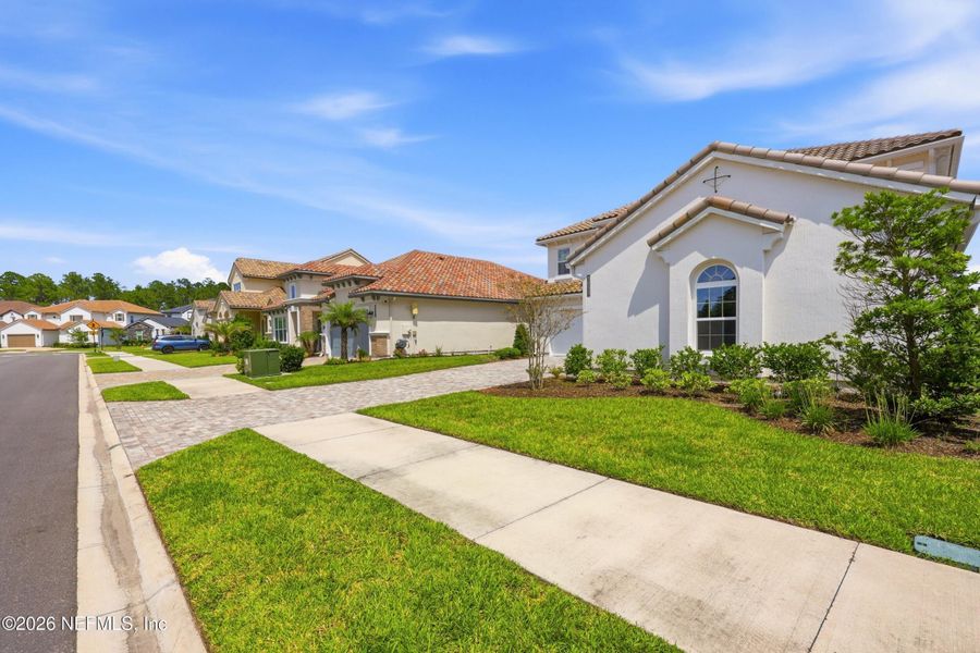 Front exterior of a new home in Tamaya, Jacksonville, FL, highlighting curb appeal (Image 2). Front exterior of a new home in Tamaya, Jacksonville, FL, highlighting curb appeal (Image 2).