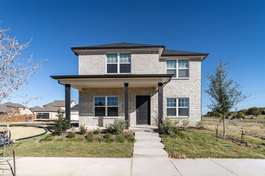 Front exterior of a new home in La Terra, Celina, TX, highlighting curb appeal (Image 1).