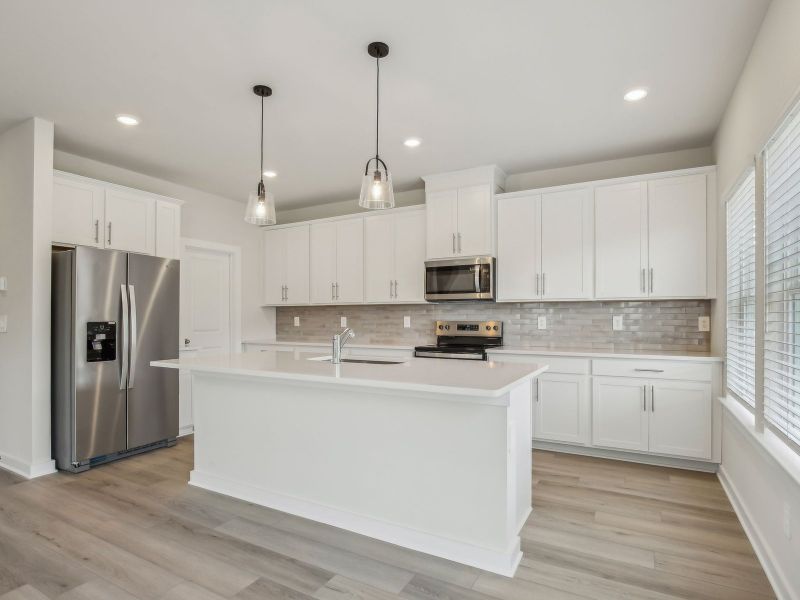 Kitchen in the Dakota floorplan in a Meritage Homes community.