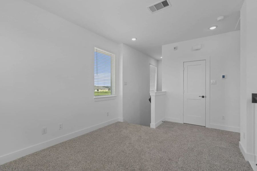 Representative unfurnished interior of a home built from the St Andrews by Chesmar Homes in Riceland Alley Loads, Mont Belvieu (Image 46).