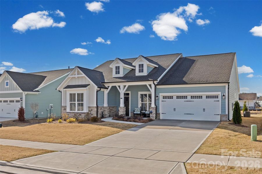 Front exterior of a new home in Encore at Harmony, Harrisburg, NC, highlighting curb appeal (Image 2). Front exterior of a new home in Encore at Harmony, Harrisburg, NC, highlighting curb appeal (Image 2).