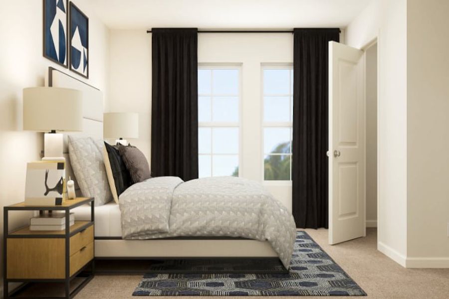 A bedroom with a large window. A bedroom with a large window.