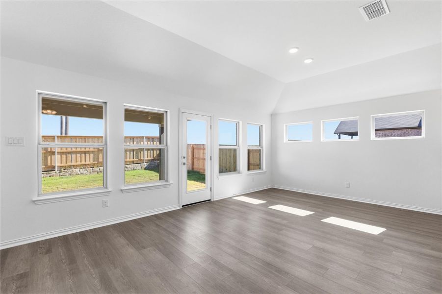 Spare room featuring wood finished floors and recessed lighting