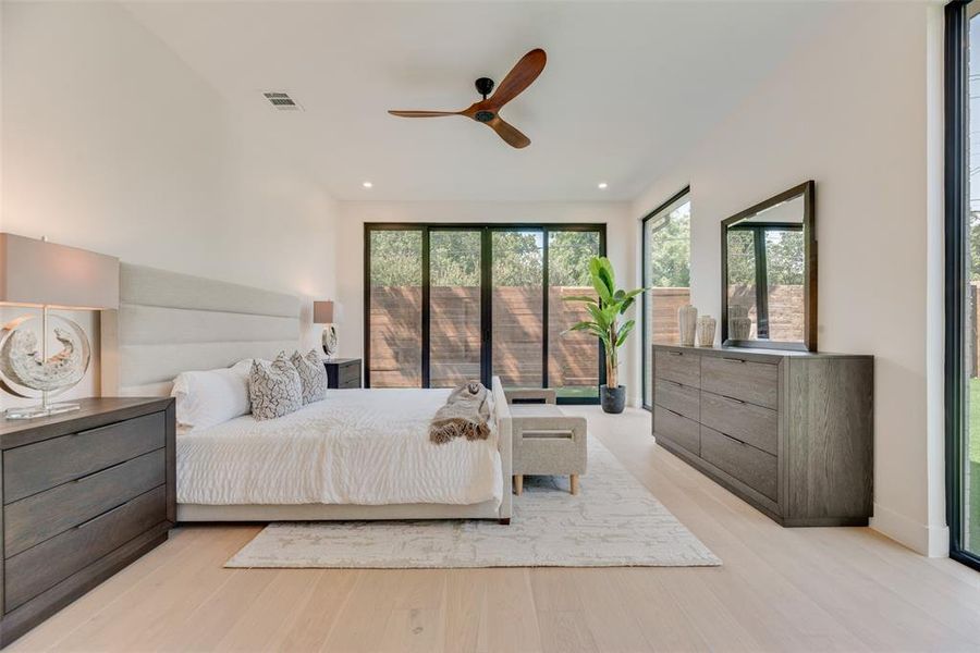 Bedroom with ceiling fan and light hardwood / wood-style floors