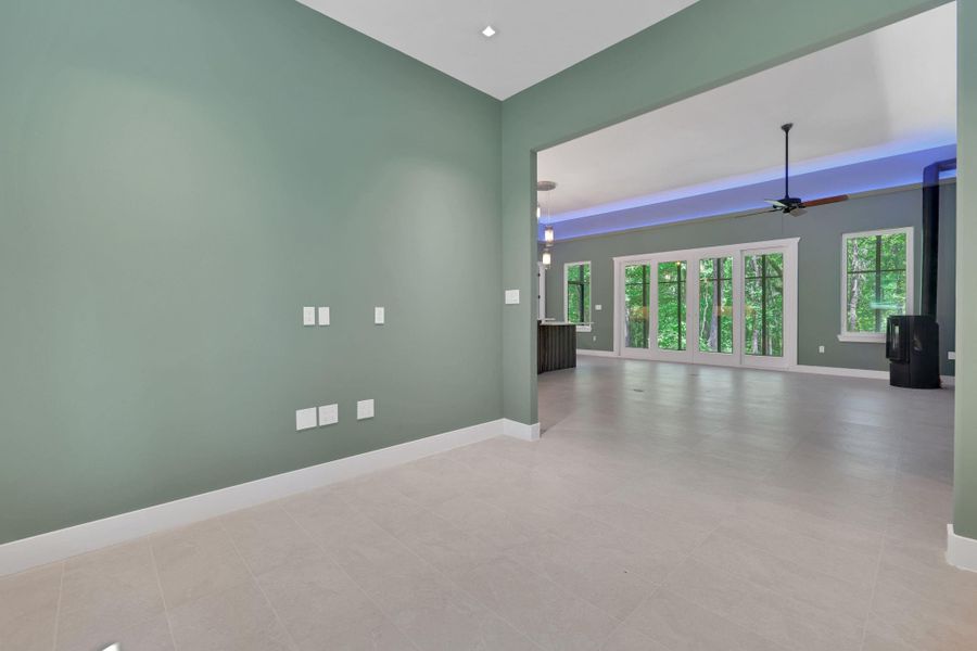 The stylish flooring extends throughout, tying the spaces together with a modern, cohesive look.