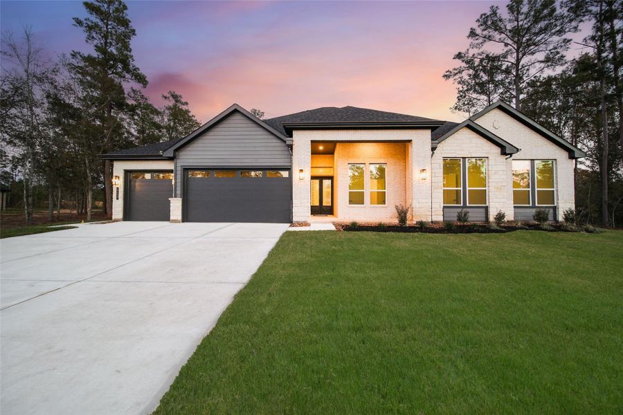 Front exterior of a new home in , Pinehurst, TX, highlighting curb appeal (Image 2). Front exterior of a new home in , Pinehurst, TX, highlighting curb appeal (Image 2).
