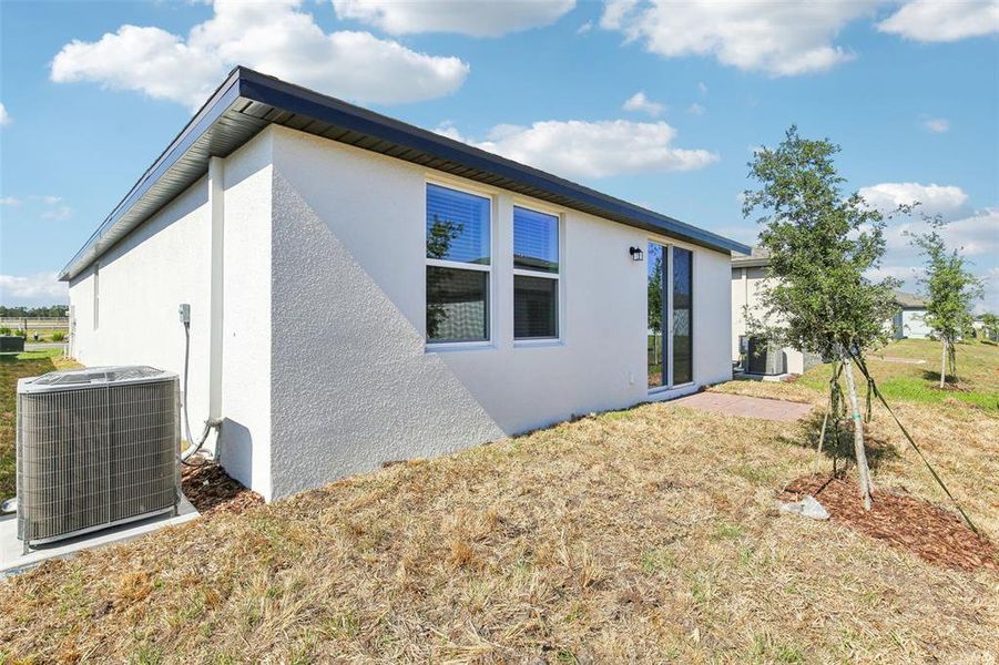 Front exterior of a new home in Villamar - Classic Series, Winter Haven, FL, highlighting curb appeal (Image 18). Front exterior of a new home in Villamar - Classic Series, Winter Haven, FL, highlighting curb appeal (Image 18).