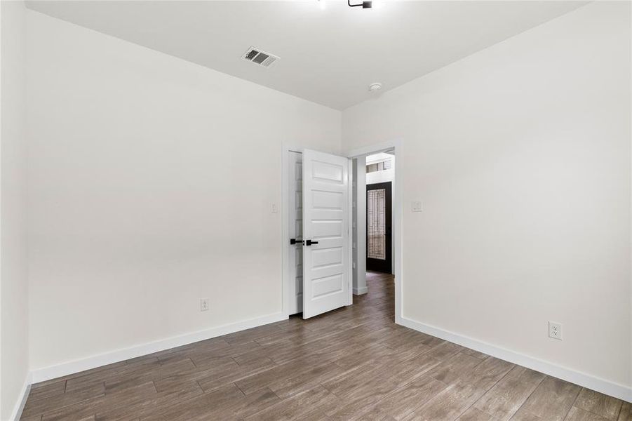 Neutral walls with wood-finish flooring