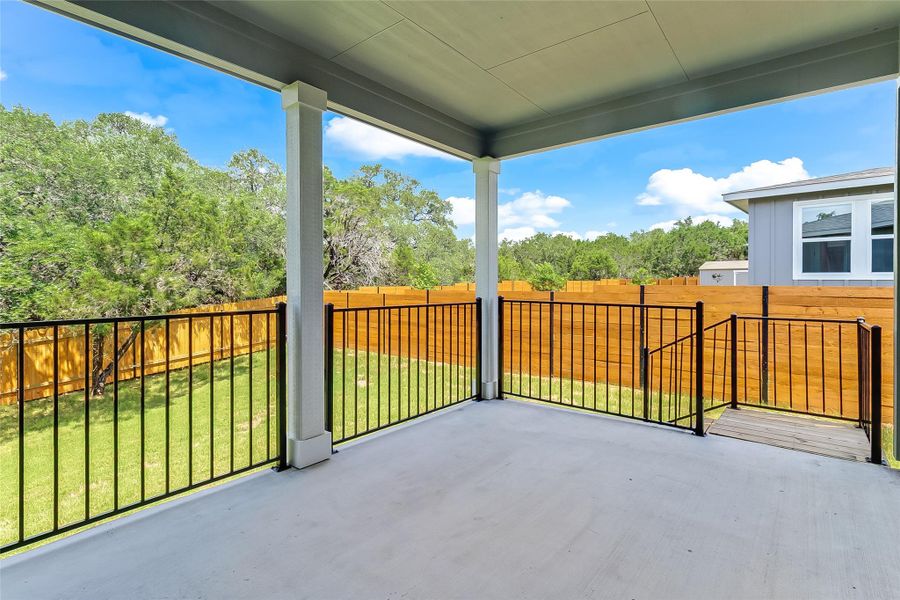 Large covered patio with iron railing Large covered patio with iron railing