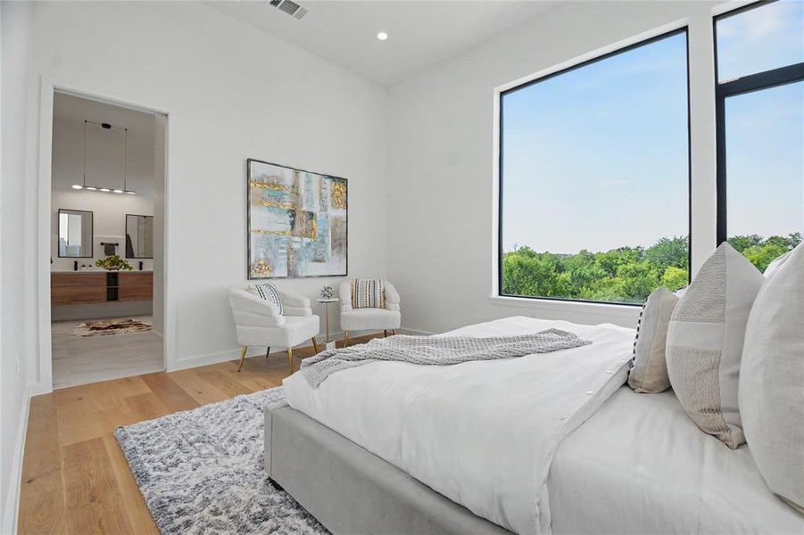 Wake up to beautiful views in your primary suite that reflects designer hotel vibes.