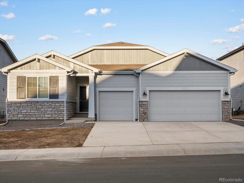 Exterior details and patio area of a home in Poudre Heights: The Alpine Collection, Windsor (Image 18).