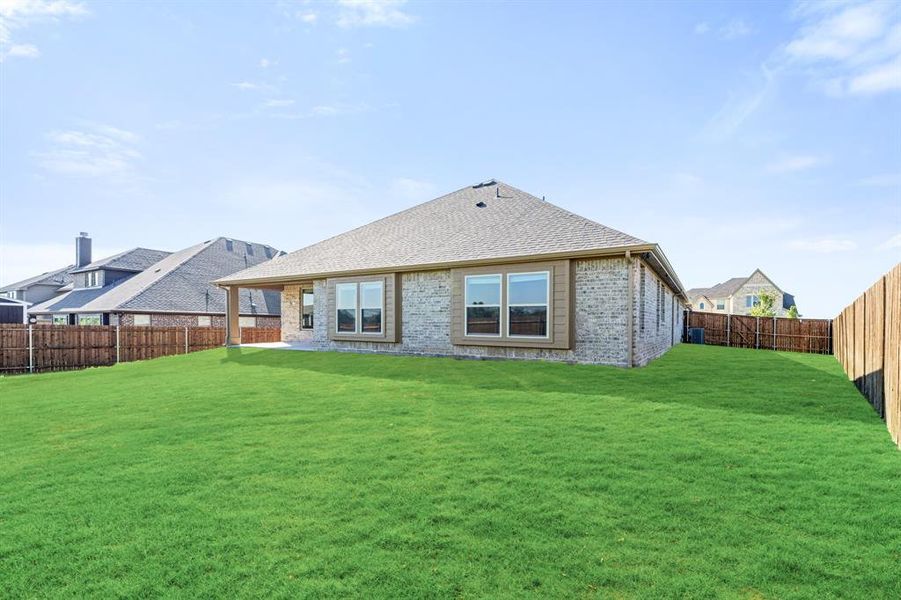 Exterior details and patio area of a home in The Grove, Midlothian (Image 16).