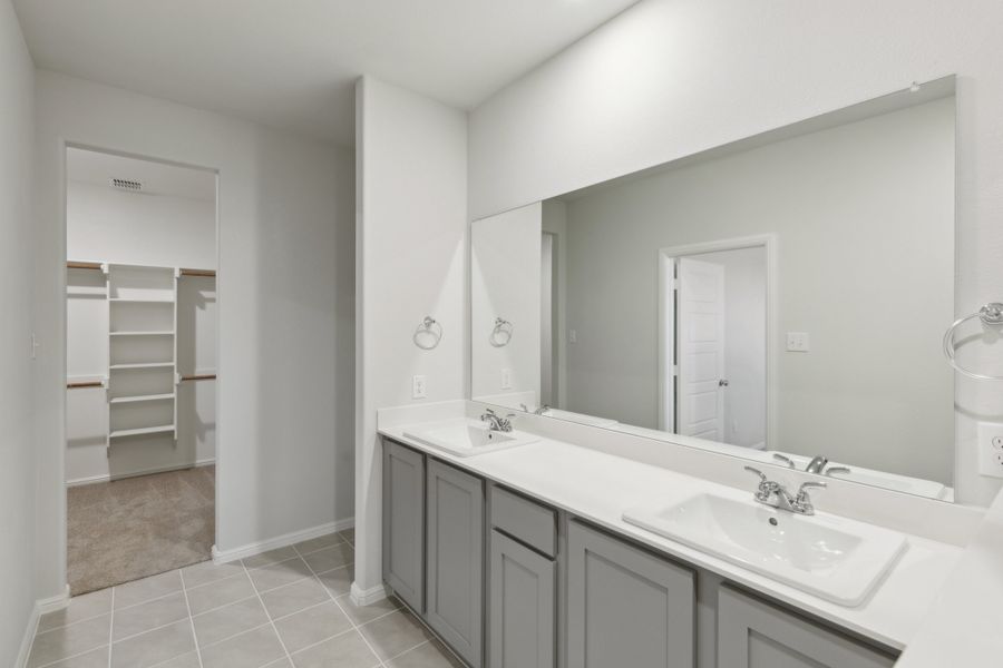 Primary Bathroom in the Holden home plan by Trophy Signature Homes – REPRESENTATIVE PHOTO