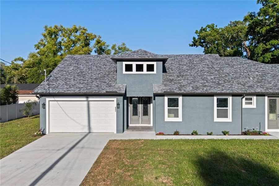 Front exterior of a new home in , Tampa, FL, highlighting curb appeal (Image 24).