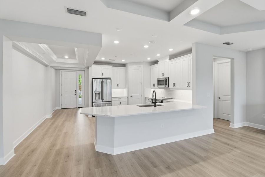 Furnished interior view inside a new home in Esplanade by the Islands Coach Homes, Naples (Image 5).