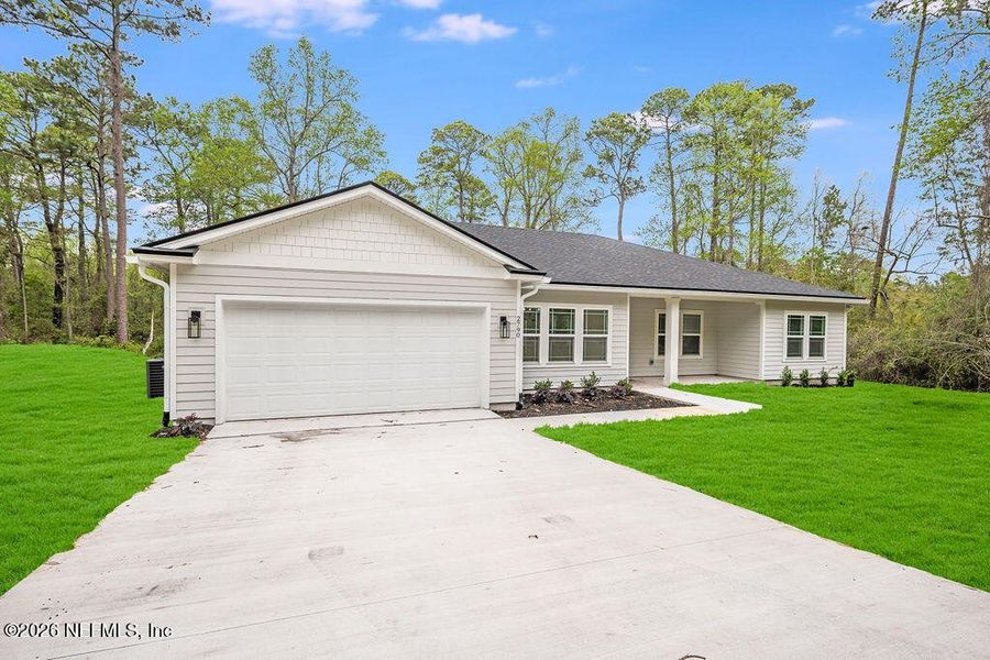 Front exterior of a new home in , Starke, FL, highlighting curb appeal (Image 1). Front exterior of a new home in , Starke, FL, highlighting curb appeal (Image 1).