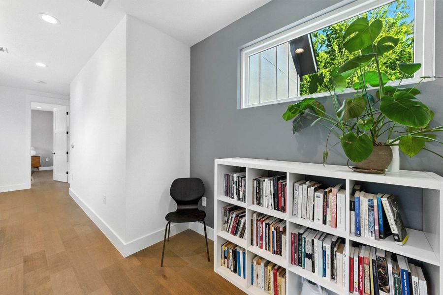 2nd floor hallway/loft. Door in back is primary bedroom. Laundry room is off picture to the left. 2nd floor hallway/loft. Door in back is primary bedroom. Laundry room is off picture to the left.