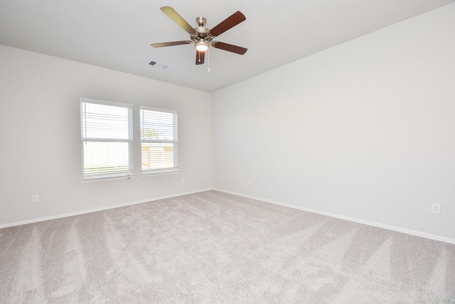 Great big windows bathe your carpeted primary suite in natural light! Great big windows bathe your carpeted primary suite in natural light!