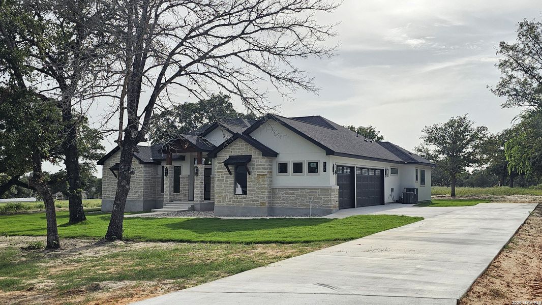 Front exterior of a new home in , Adkins, TX, highlighting curb appeal (Image 2). Front exterior of a new home in , Adkins, TX, highlighting curb appeal (Image 2).