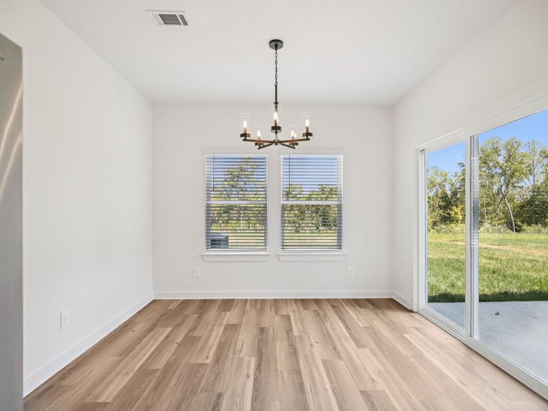 The open-concept floorplan allows for an easy flow between the kitchen and dining areas.
