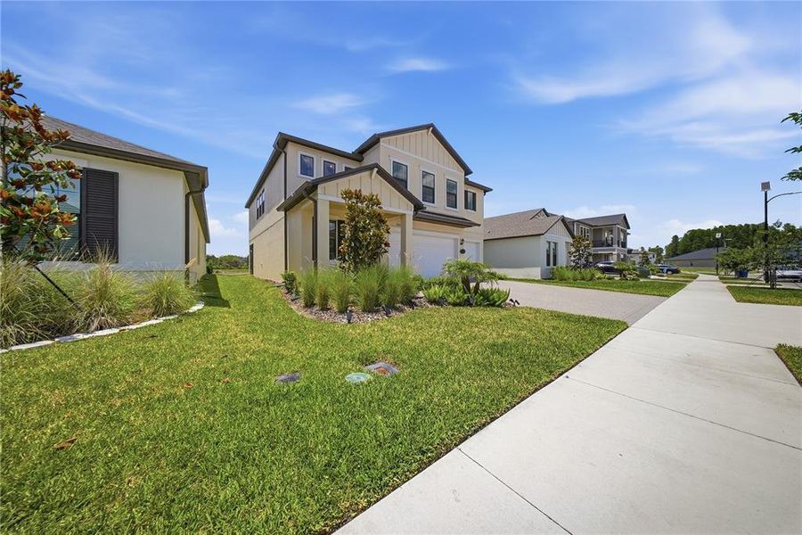 Front exterior of a new home in Connerton, Land O' Lakes, FL, highlighting curb appeal (Image 2).