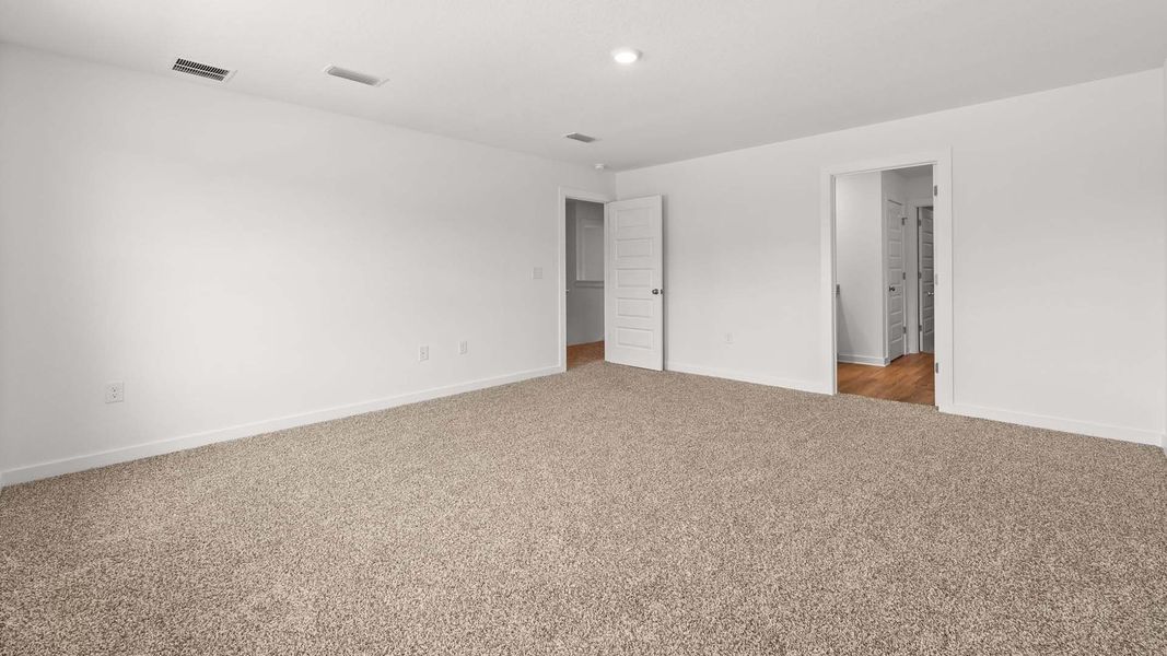 Spacious, unfurnished interior of a new home in Magnolia at the Bluffs Phase 3, Freeport (Image 13).