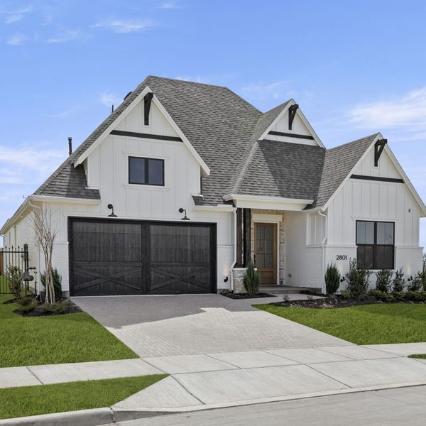 Front exterior of a new home in Mustang Lakes, Celina, TX, highlighting curb appeal (Image 30). Front exterior of a new home in Mustang Lakes, Celina, TX, highlighting curb appeal (Image 30).