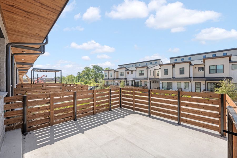 Exterior details and patio area of a home in Willow Grove Townhomes, Melissa (Image 3).