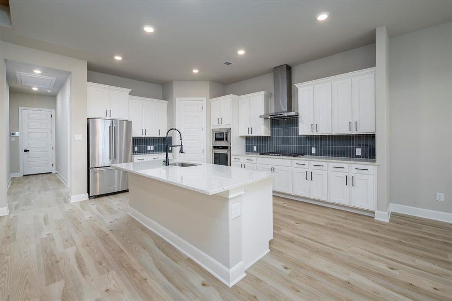 The incredible kitchen overlooks the dining area and the family room offering the perfect backdrop for entertaining, homecooked meals and making memories with the ones you love.