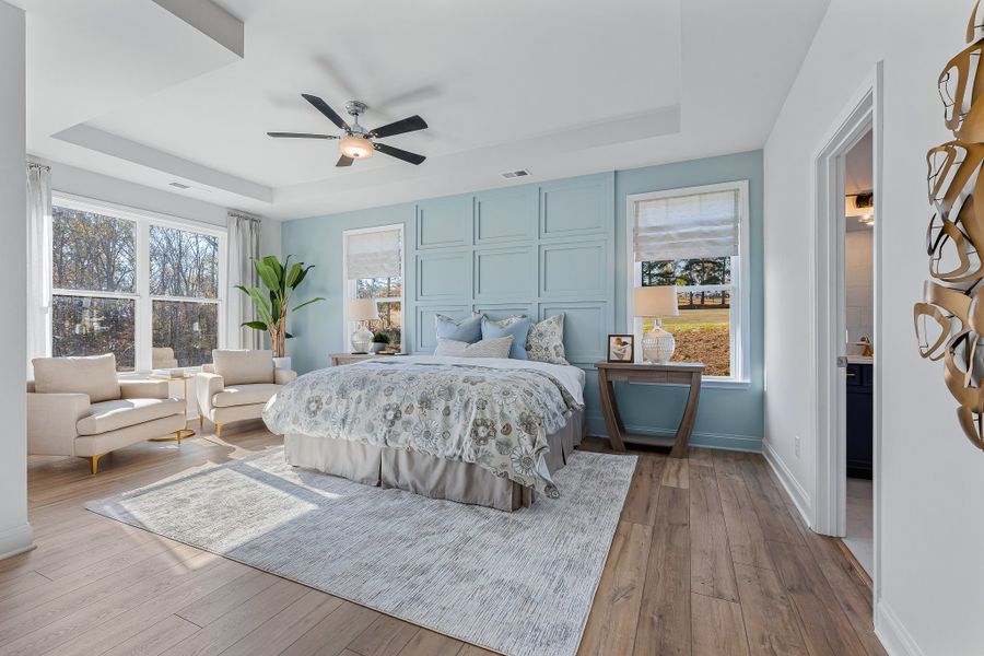 A bedroom with a bed and a couch.