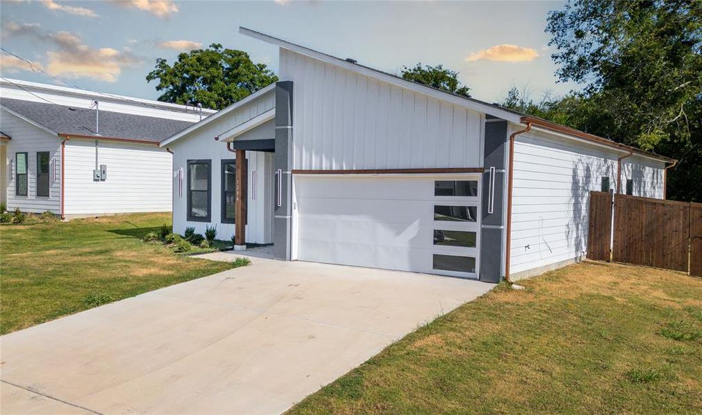 Front exterior of a new home in , Greenville, TX, highlighting curb appeal (Image 15). Front exterior of a new home in , Greenville, TX, highlighting curb appeal (Image 15).