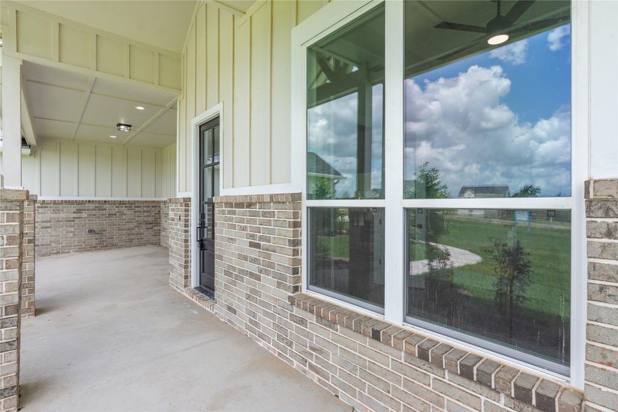 Spacious covered porch, ideal for enjoying outdoor views Spacious covered porch, ideal for enjoying outdoor views