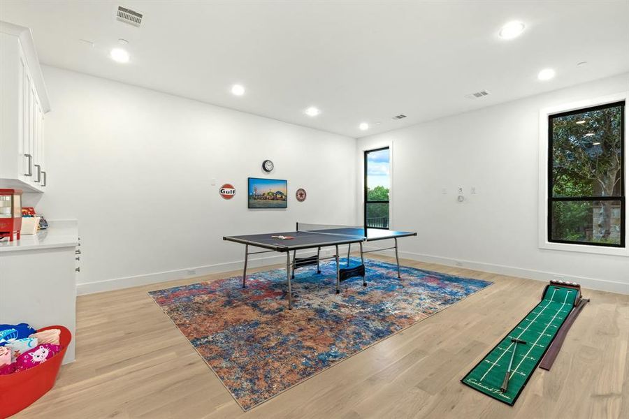 Downstairs game room with cabinetry Downstairs game room with cabinetry