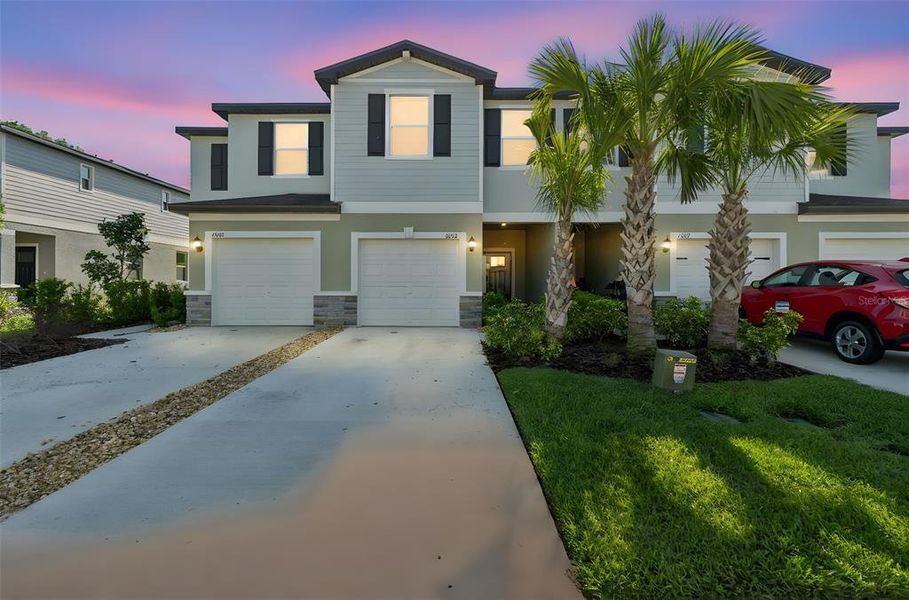 Front exterior of a new home in , Land O' Lakes, FL, highlighting curb appeal (Image 27).