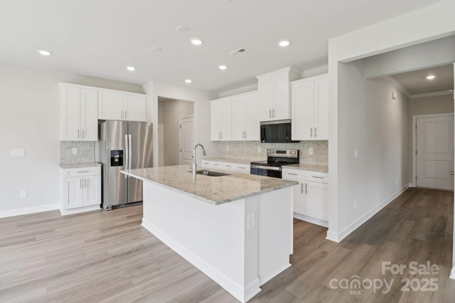 Furnished interior view inside a new home in Harper Landing, Stanley (Image 7).
