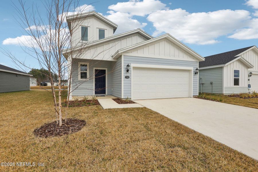 Front exterior of a new home in Kings Preserve, Jacksonville, FL, highlighting curb appeal (Image 2). Front exterior of a new home in Kings Preserve, Jacksonville, FL, highlighting curb appeal (Image 2).