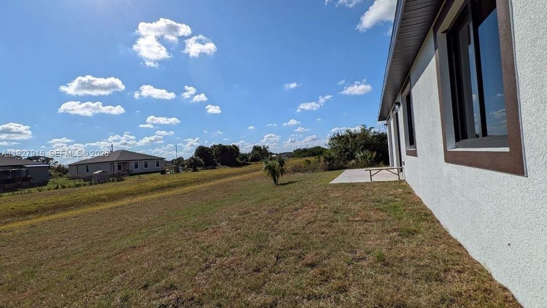 Exterior details and patio area of a home in , Labelle (Image 3).