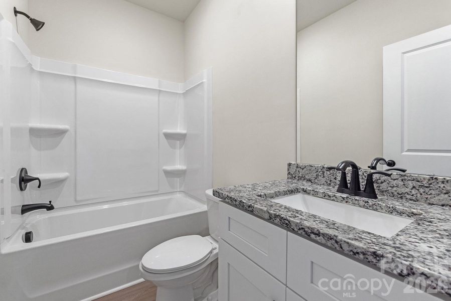 Furnished interior view inside a new home in Ascot Woods, Charlotte (Image 12).