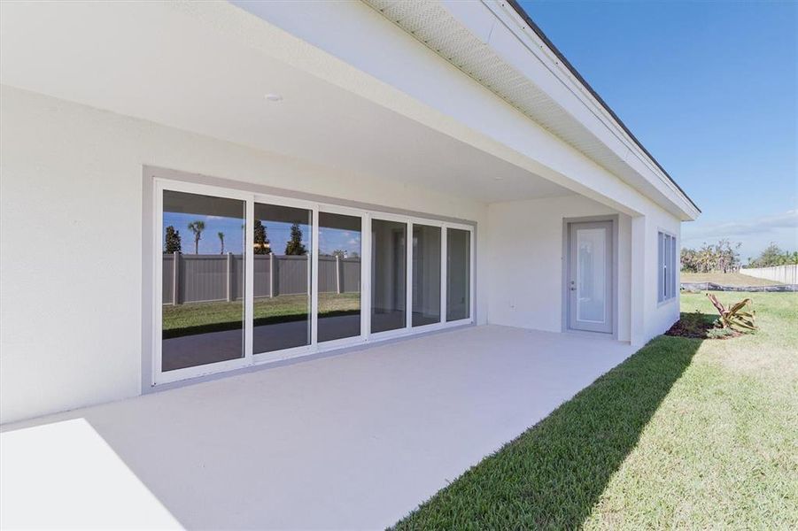 Exterior details and patio area of a home in Oakfield, Parrish (Image 23).