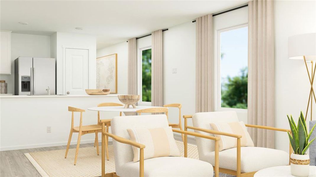 Sitting room with light hardwood / wood-style floors